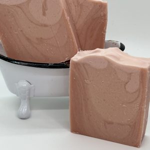 Love Spell goat milk soap with pink ombré layers and handcrafted artisan design