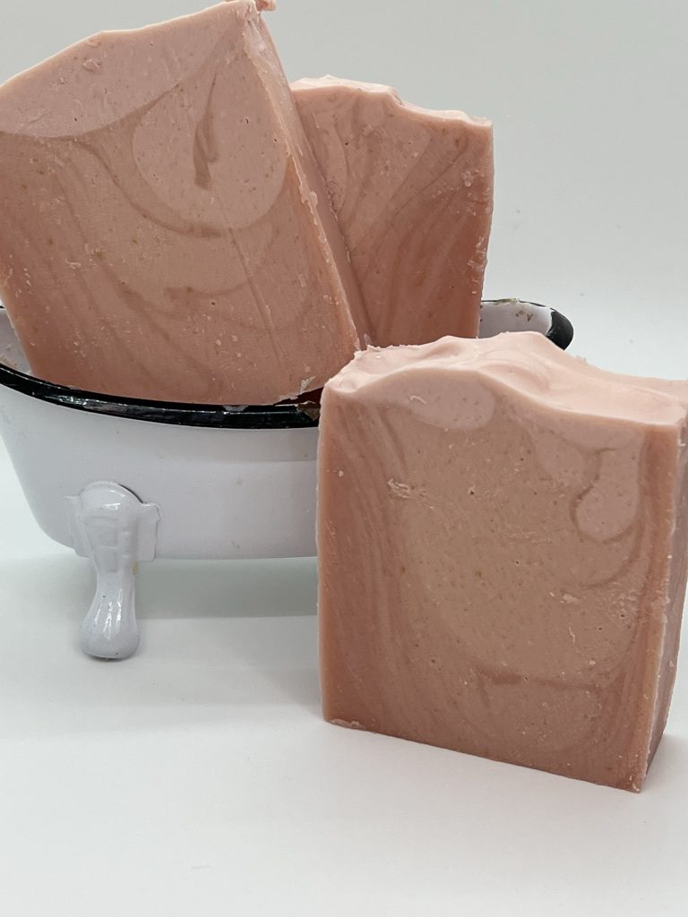 Love Spell goat milk soap with pink ombré layers and handcrafted artisan design