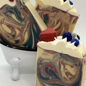 Berry Blast goat milk soap with colorful swirls and handcrafted berry soap toppings